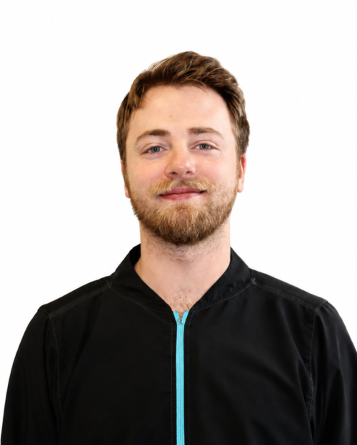 Photo of white male in black jacket with blue zipper