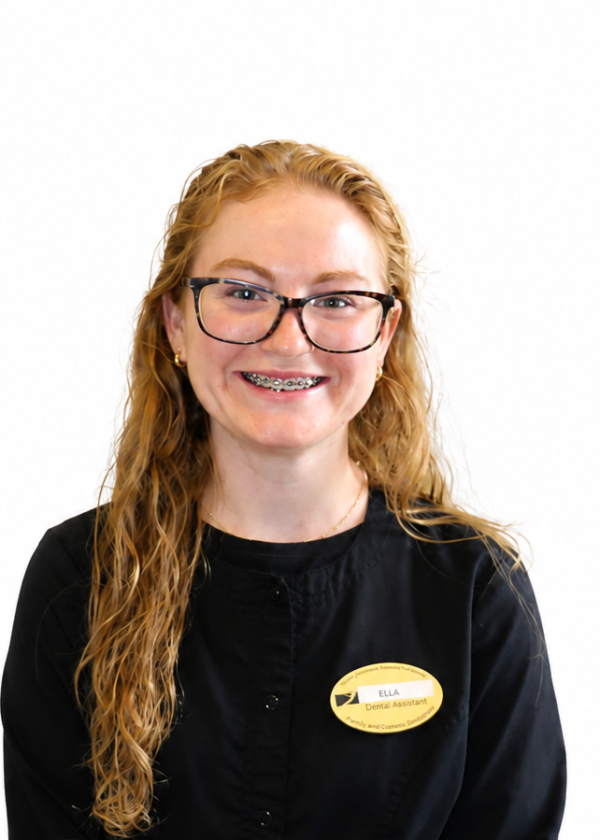 Photo of white woman with long hair and glasses in black jacket with nametag